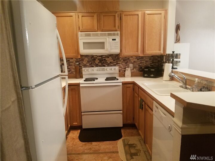 Property Photo:  6716 S 238th Place G106  WA 98032 