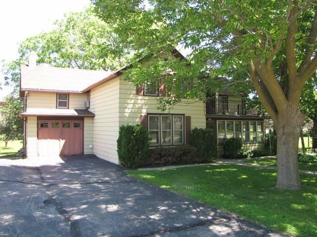 Property Photo:  210 Hartford Rd  WI 53086-9545 