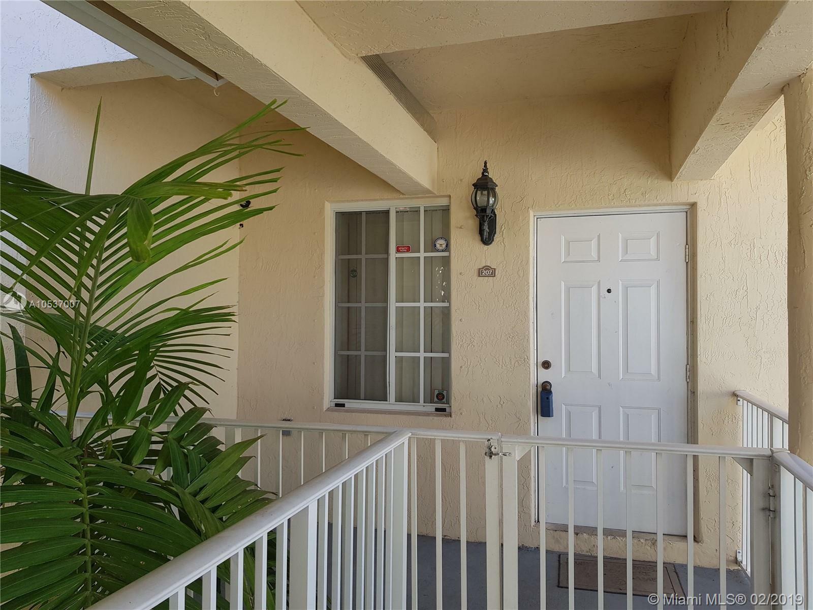 Property Photo:  6900 NW 179th St 207-1  FL 33015 