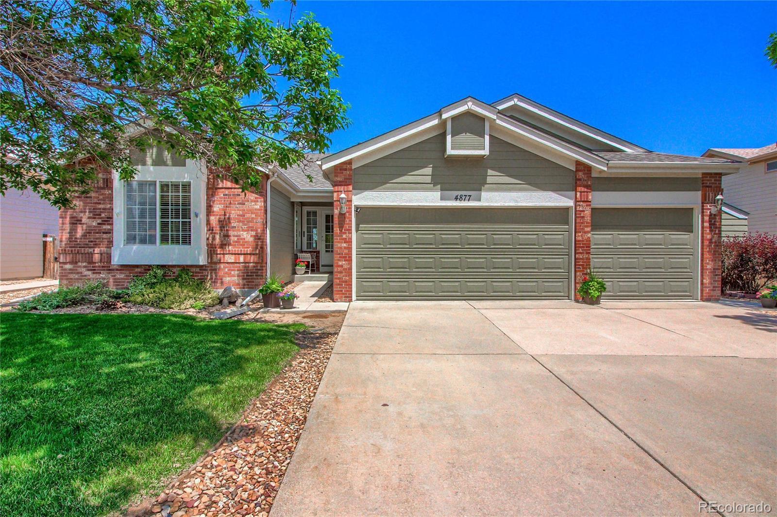 Property Photo:  4877 S Danube Way  CO 80015 
