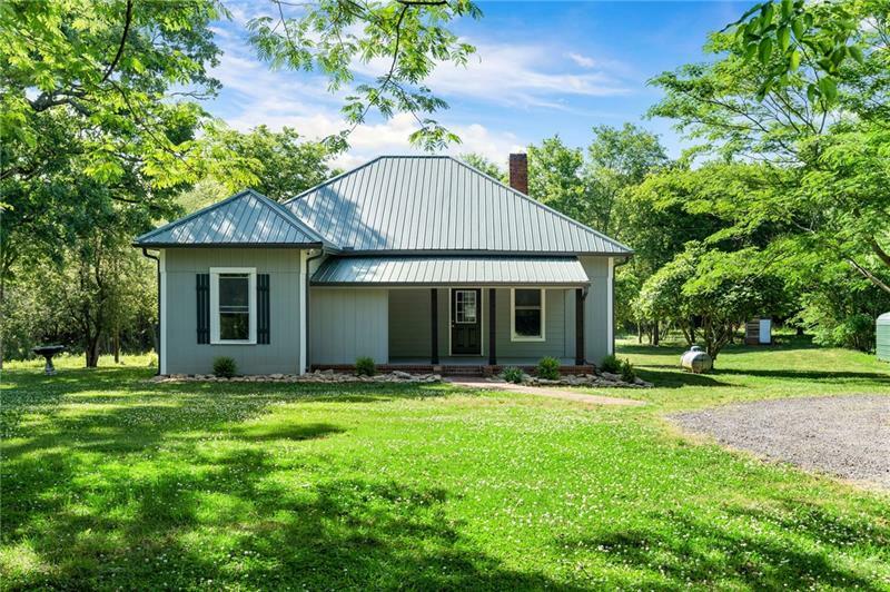 Property Photo:  7404 New Calhoun Road NE  GA 30103 