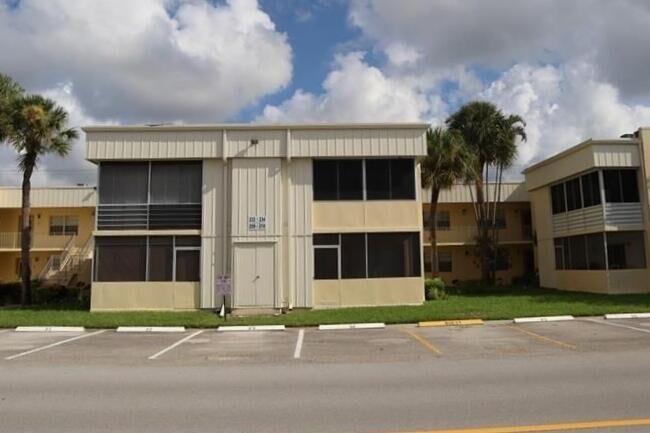 Property Photo:  210 Normandy E  FL 33483 