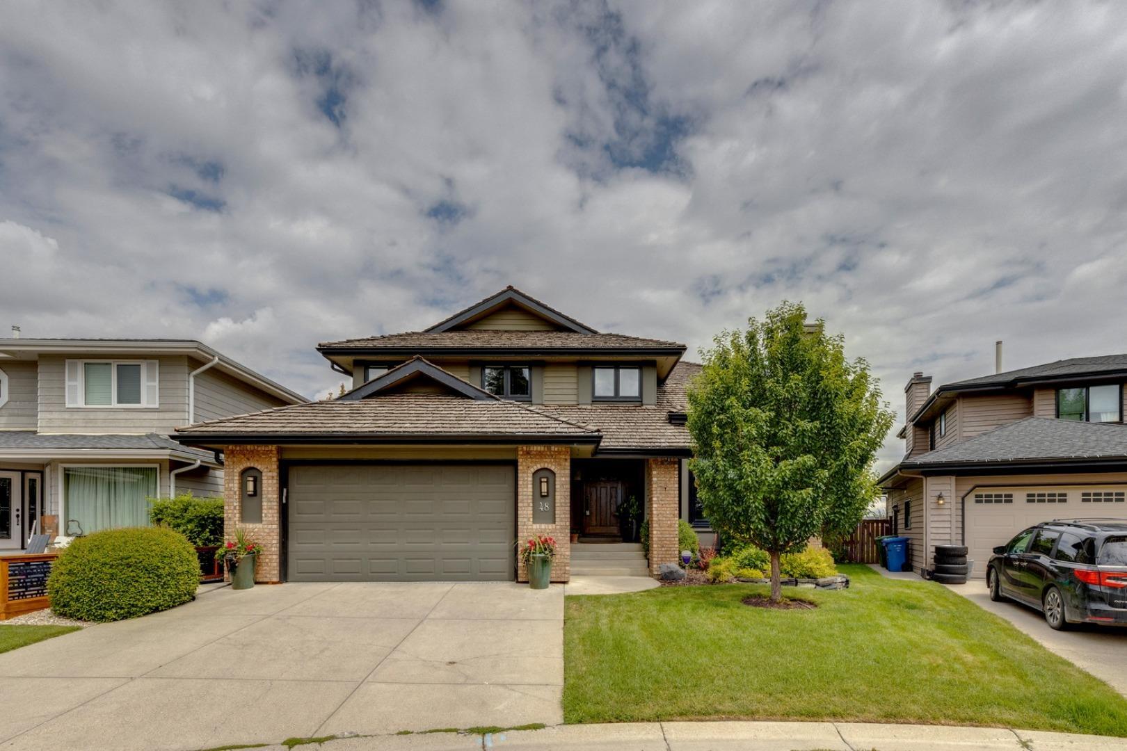Property Photo: 48 Sunset Close SE AB T2X 3A8