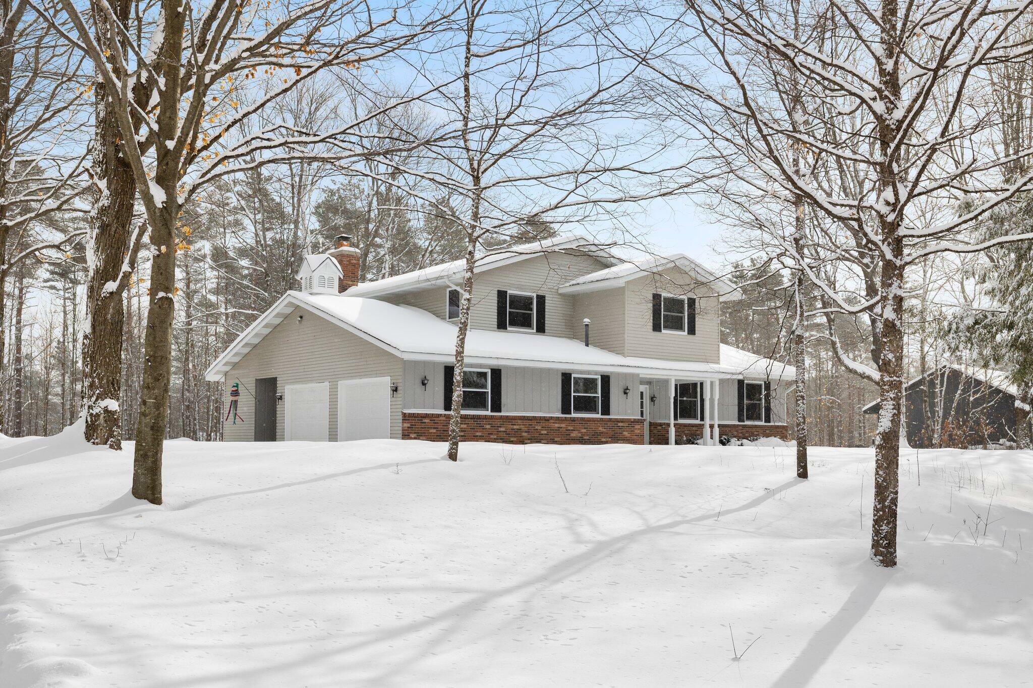 Property Photo:  910 Woodcrest Drive  MI 49735 