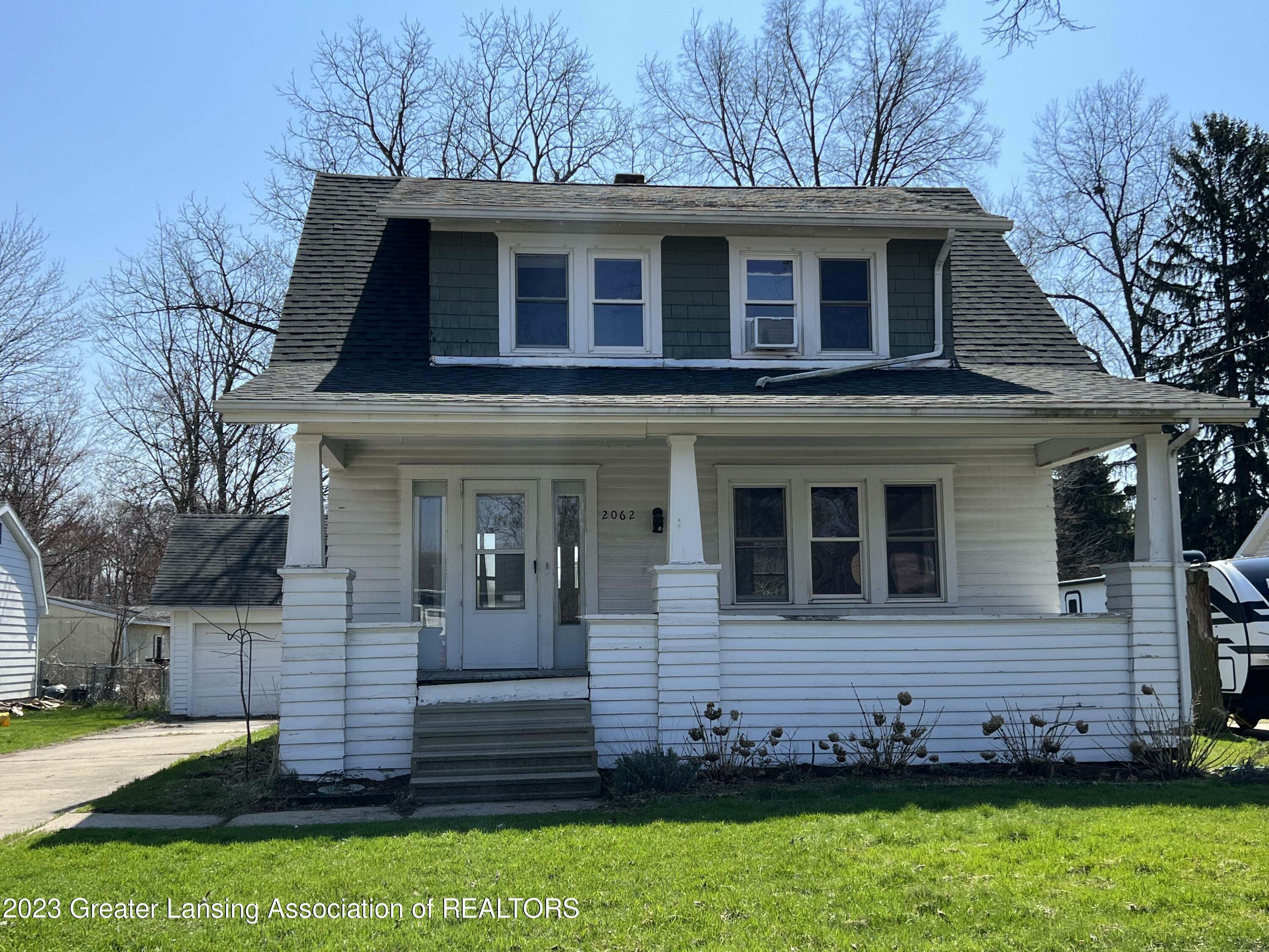 Property Photo:  2062 NE Delhi Street  MI 48842 