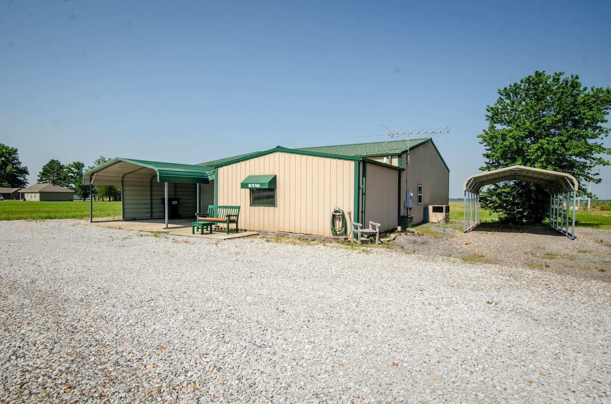 Property Photo:  501 W Peck Road  AR 72432 