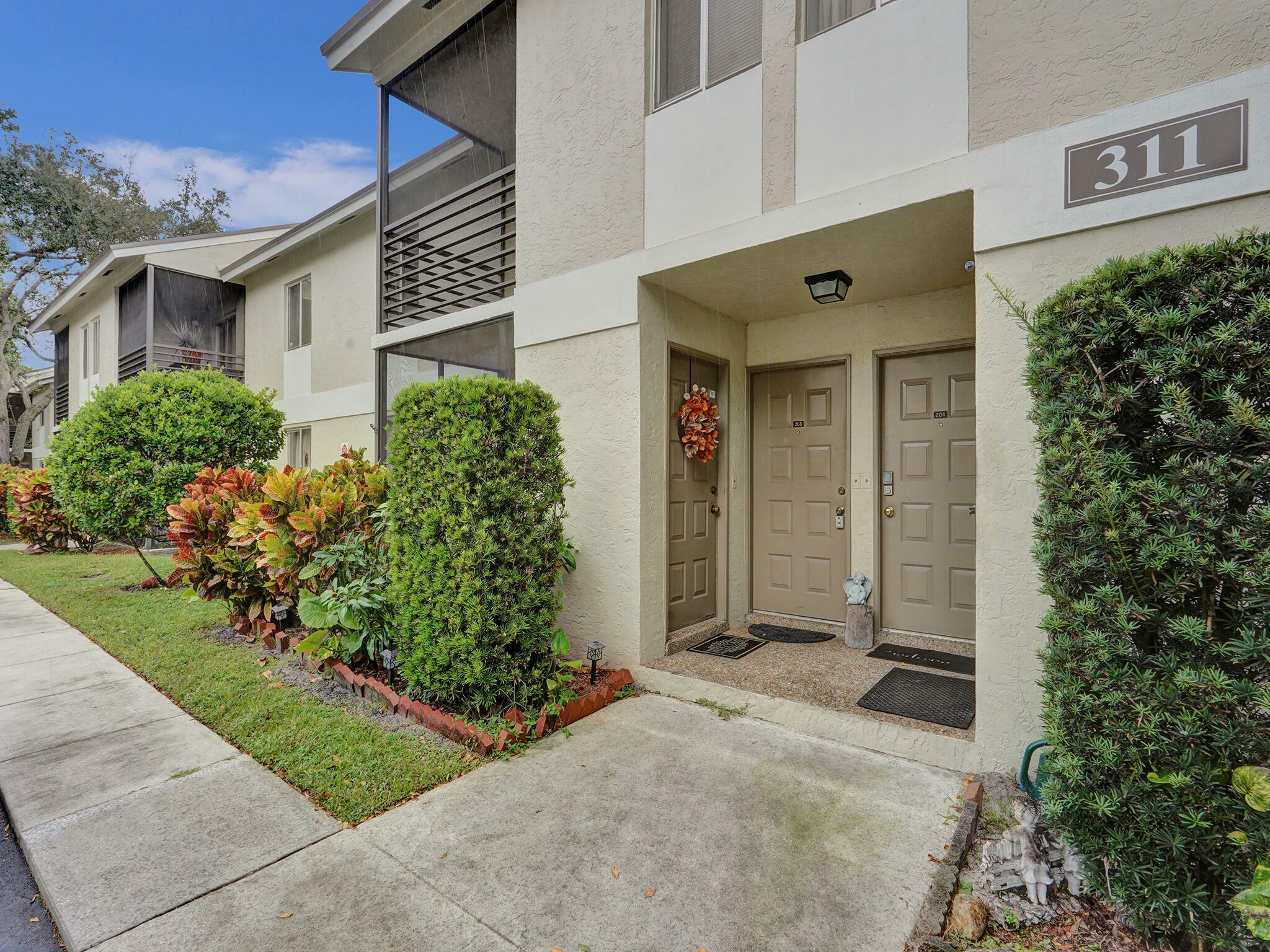 Property Photo:  311 Gardens Drive 204  FL 33069 