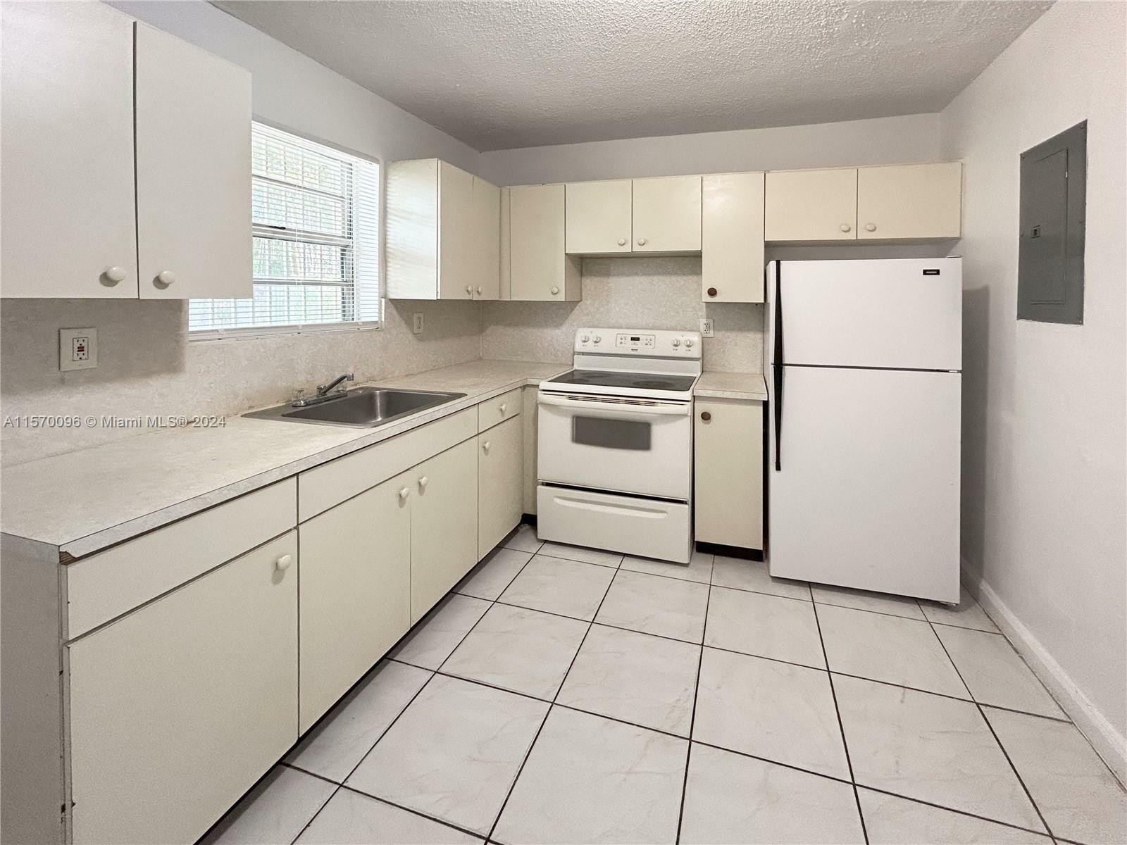 Property Photo:  220 NW 59th St 222  FL 33127 