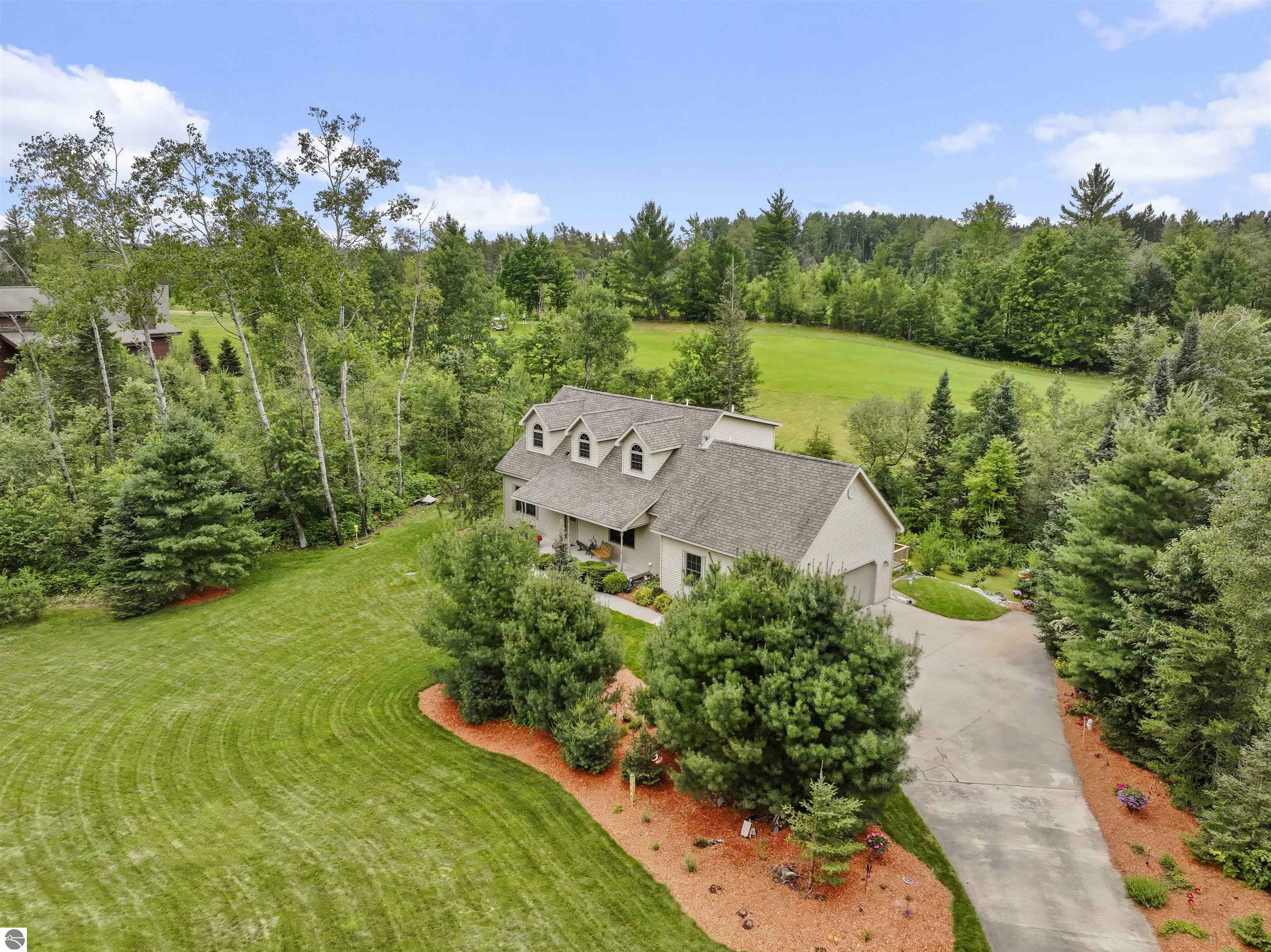 Property Photo:  627 White Pine Drive  MI 49601 