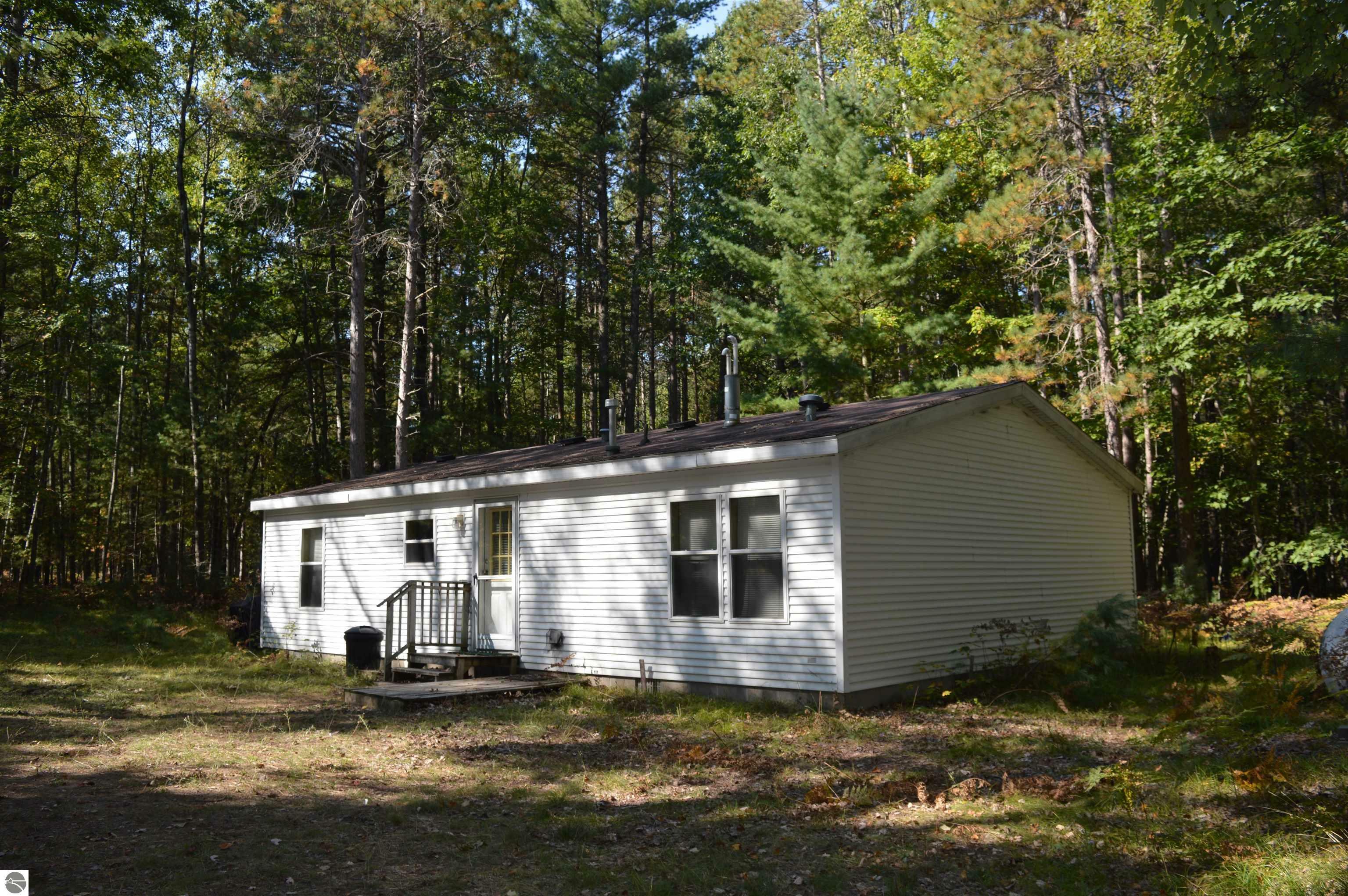 Property Photo:  6188 SW Jesses Trail  MI 49680 