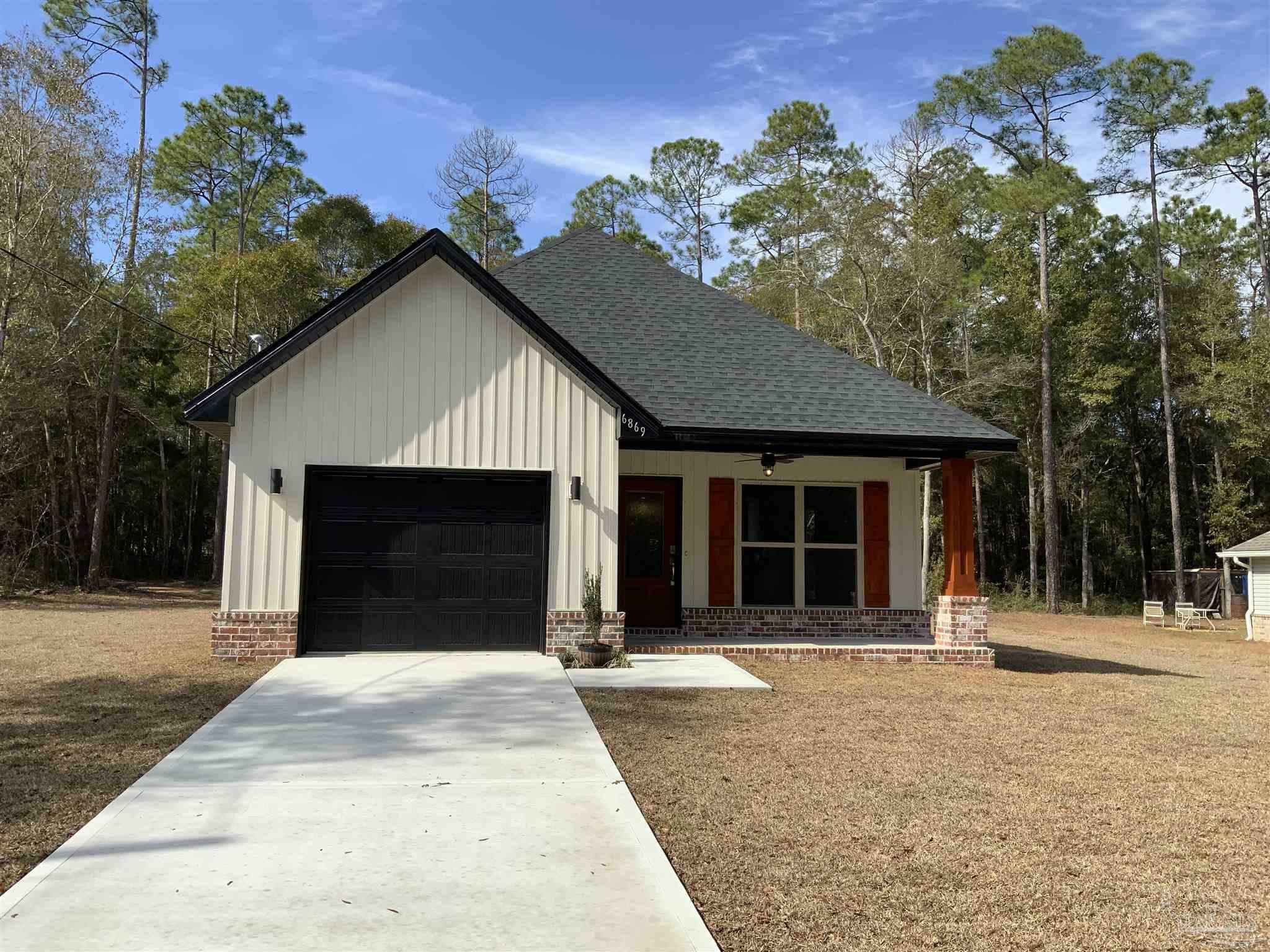 Property Photo: 6869 Roundup Ln FL 32570