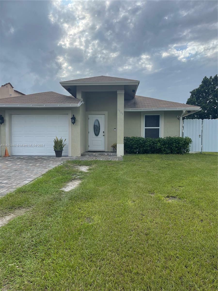 Property Photo:  1369 Rainbow Ave  FL 33406 