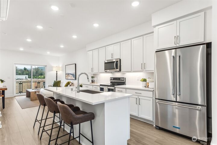 Property Photo:  1243  Oxbow Way SE 2405  WA 98045 