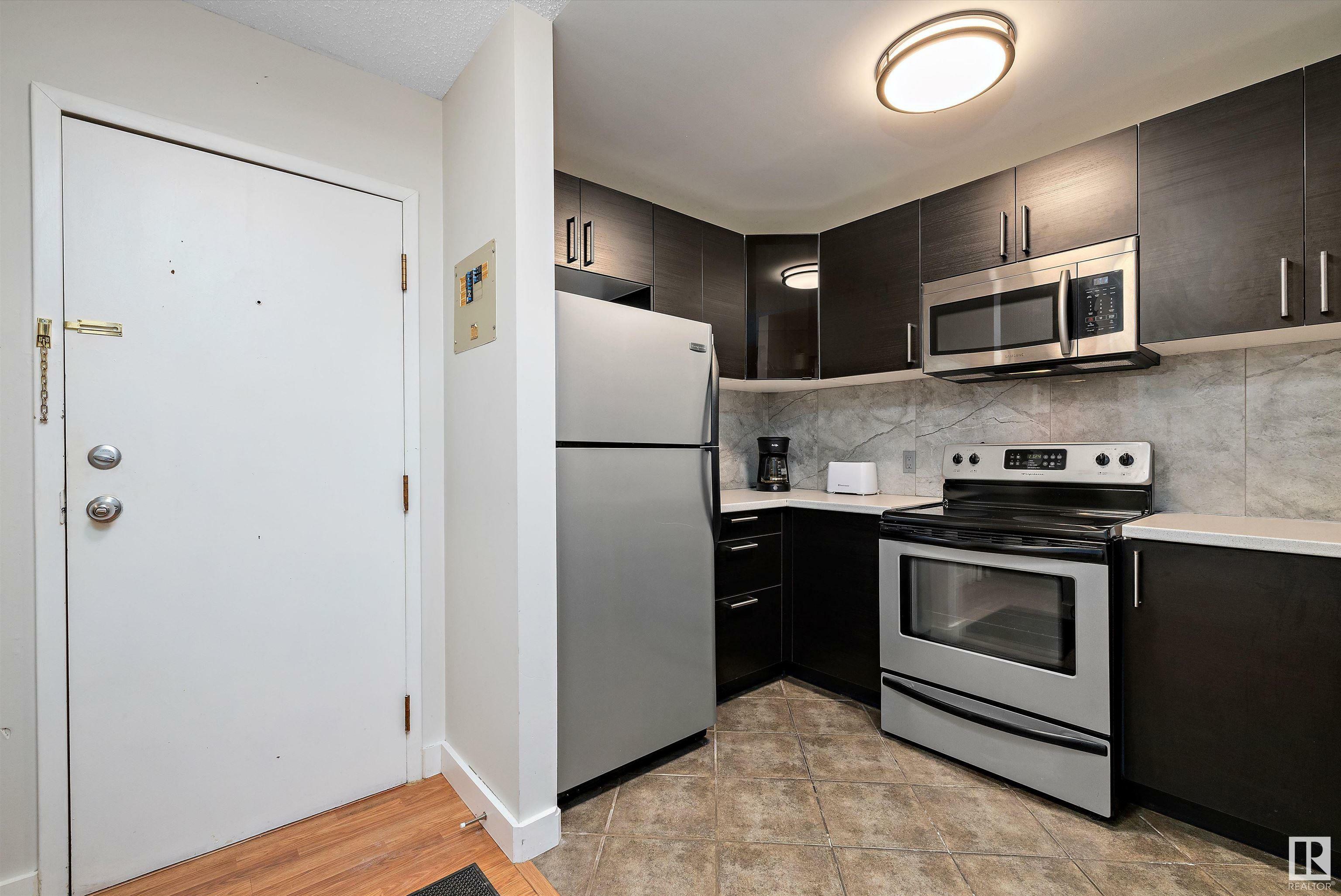 Property Photo:  14916 26 Street NW 205  AB T5Y 2G4 