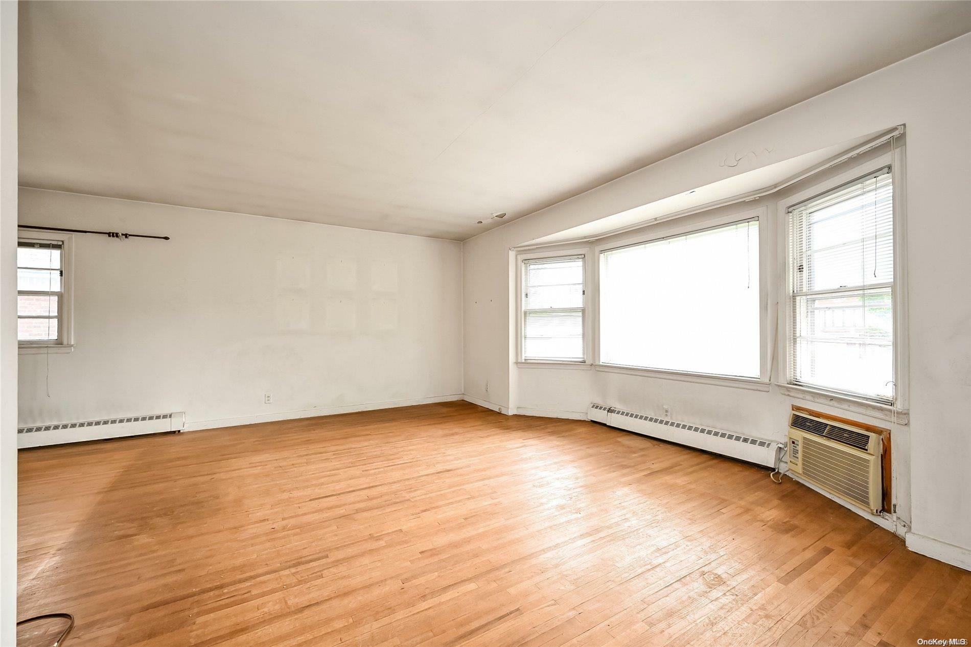 Property Photo:  229-11 56th Avenue  NY 11364 