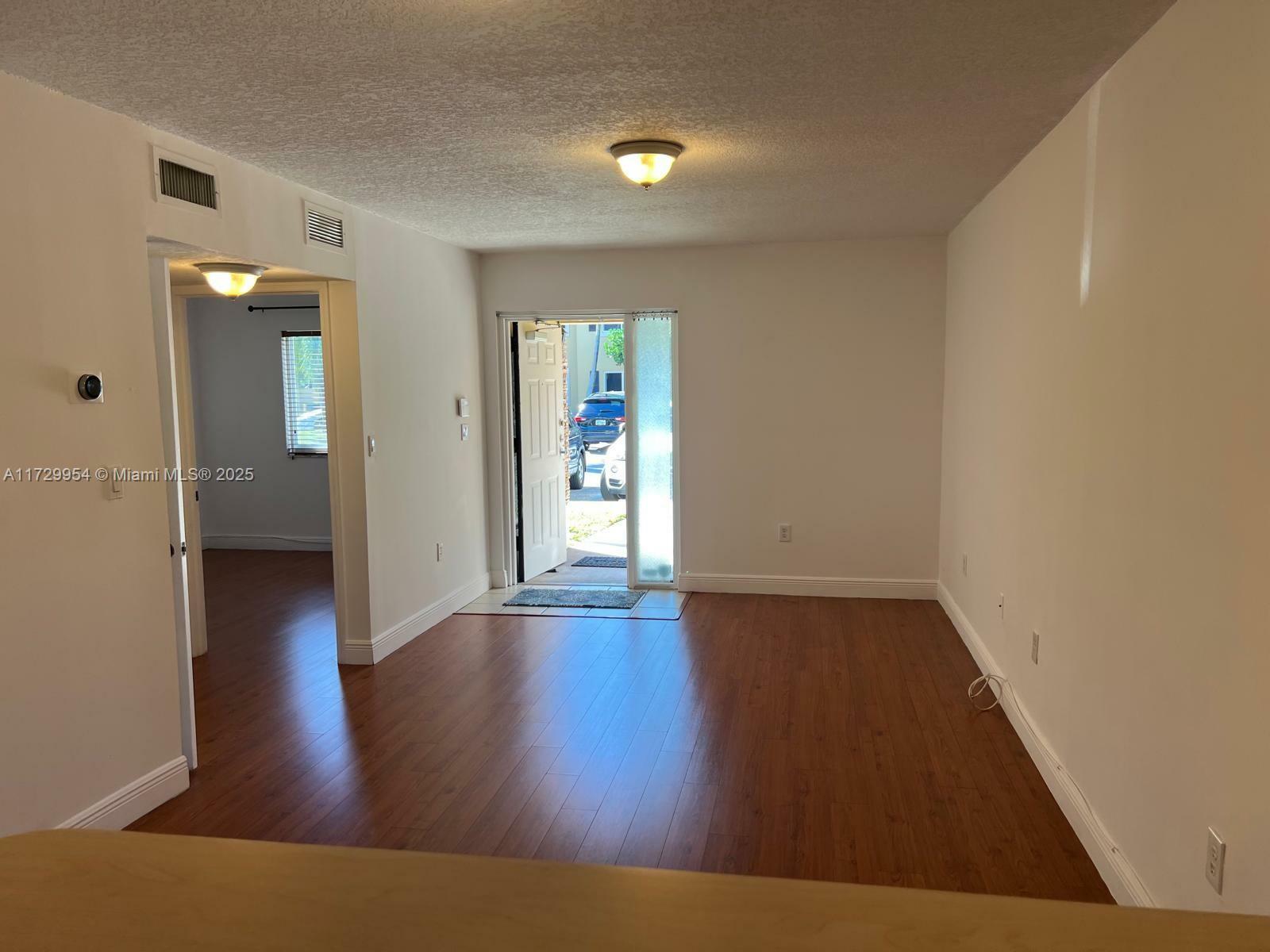 Property Photo:  945 NE 34th Ave 103  FL 33033 