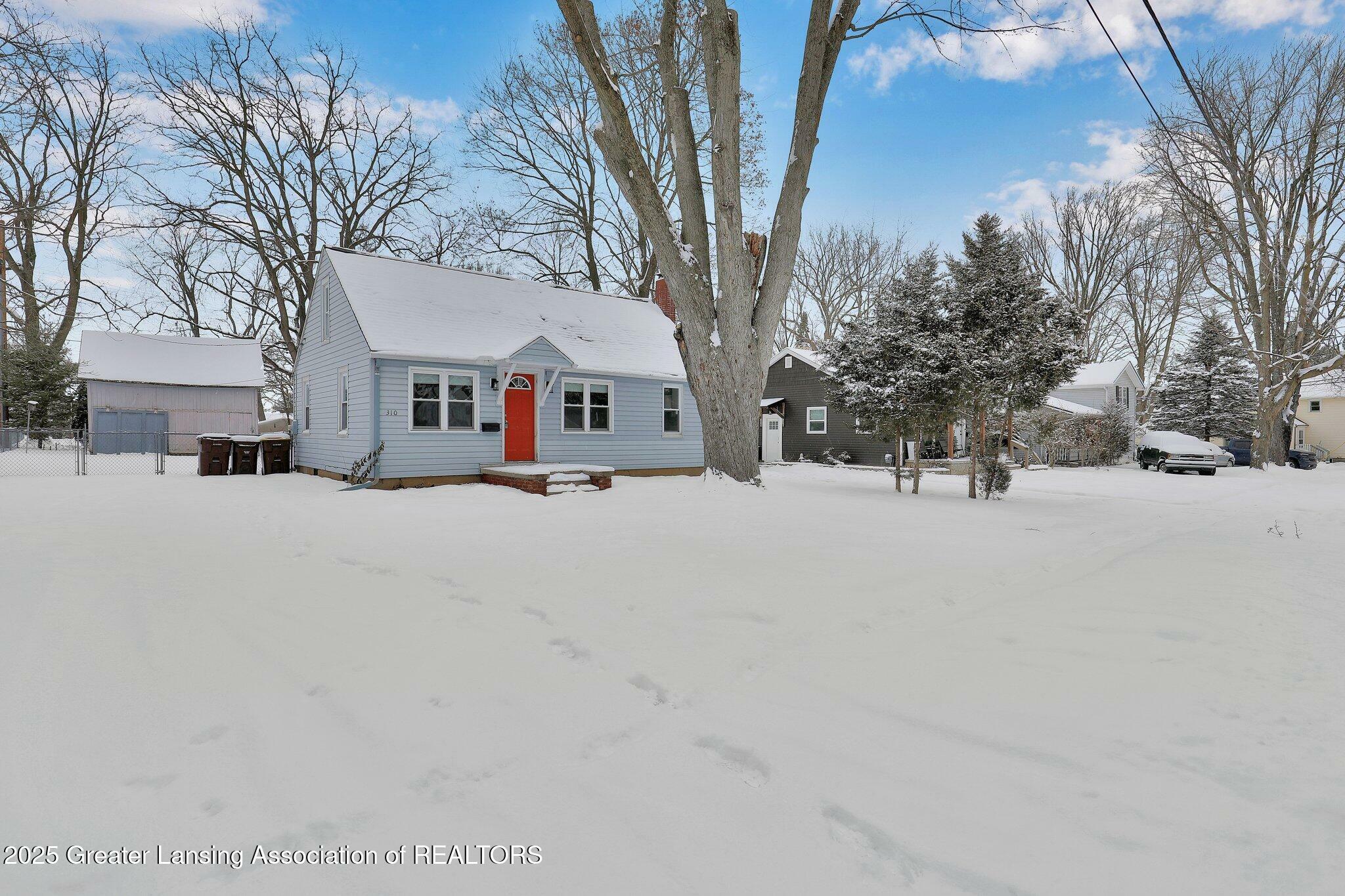 Property Photo:  310 Crossman Street  MI 48895 