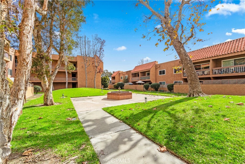 Property Photo:  6600 Warner Avenue 118  CA 92647 