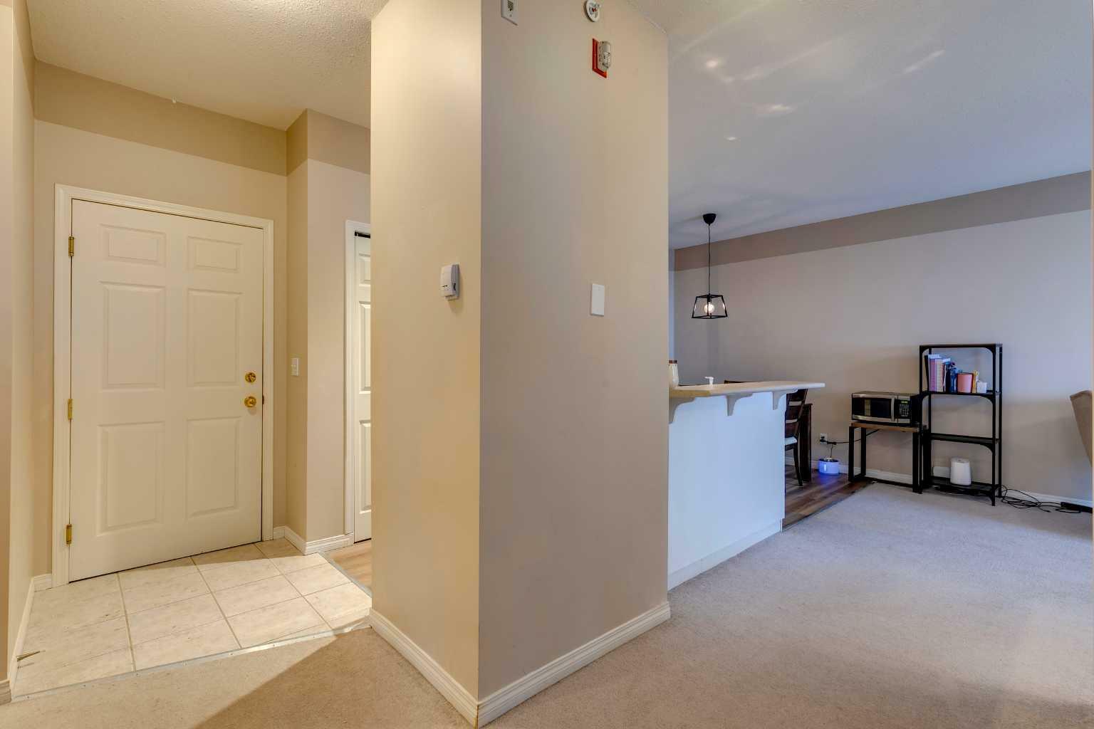 Property Photo:  16 Poplar Avenue 403  AB T1S 1Z5 