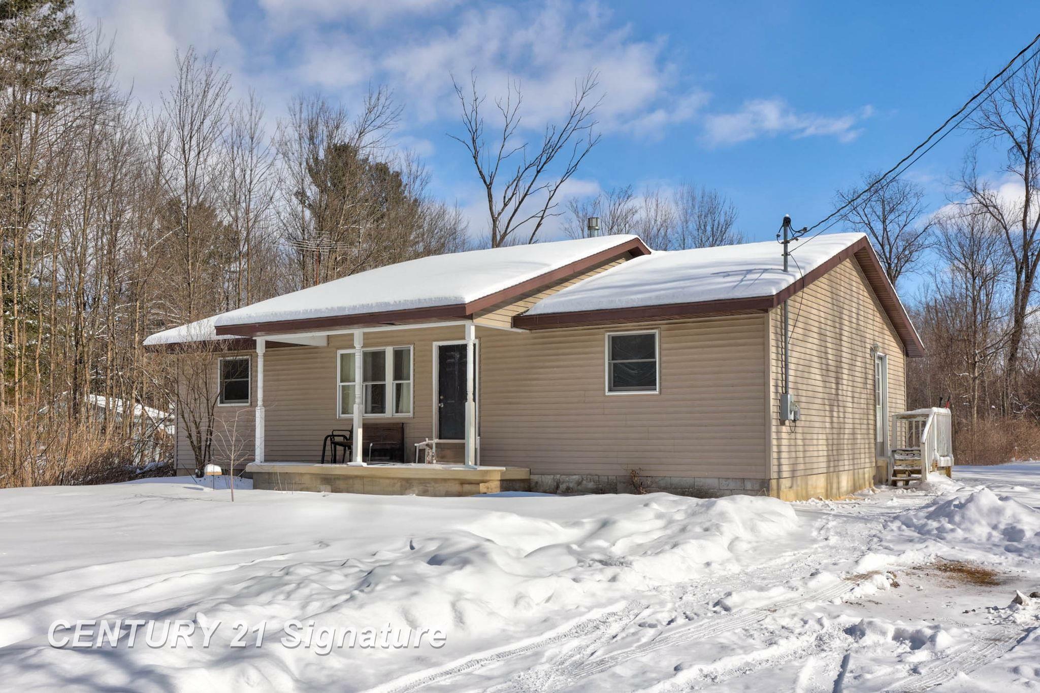 Property Photo:  4909 Caine Road  MI 48768 