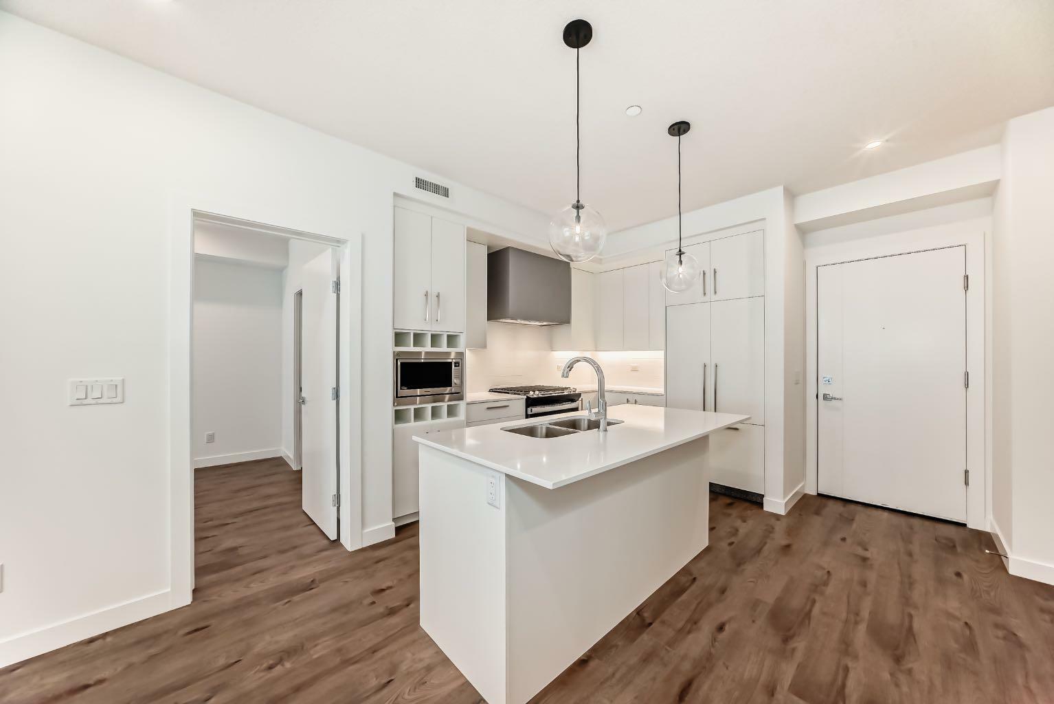 Property Photo: 8370 Broadcast Avenue SW 205 AB T3H 6L3