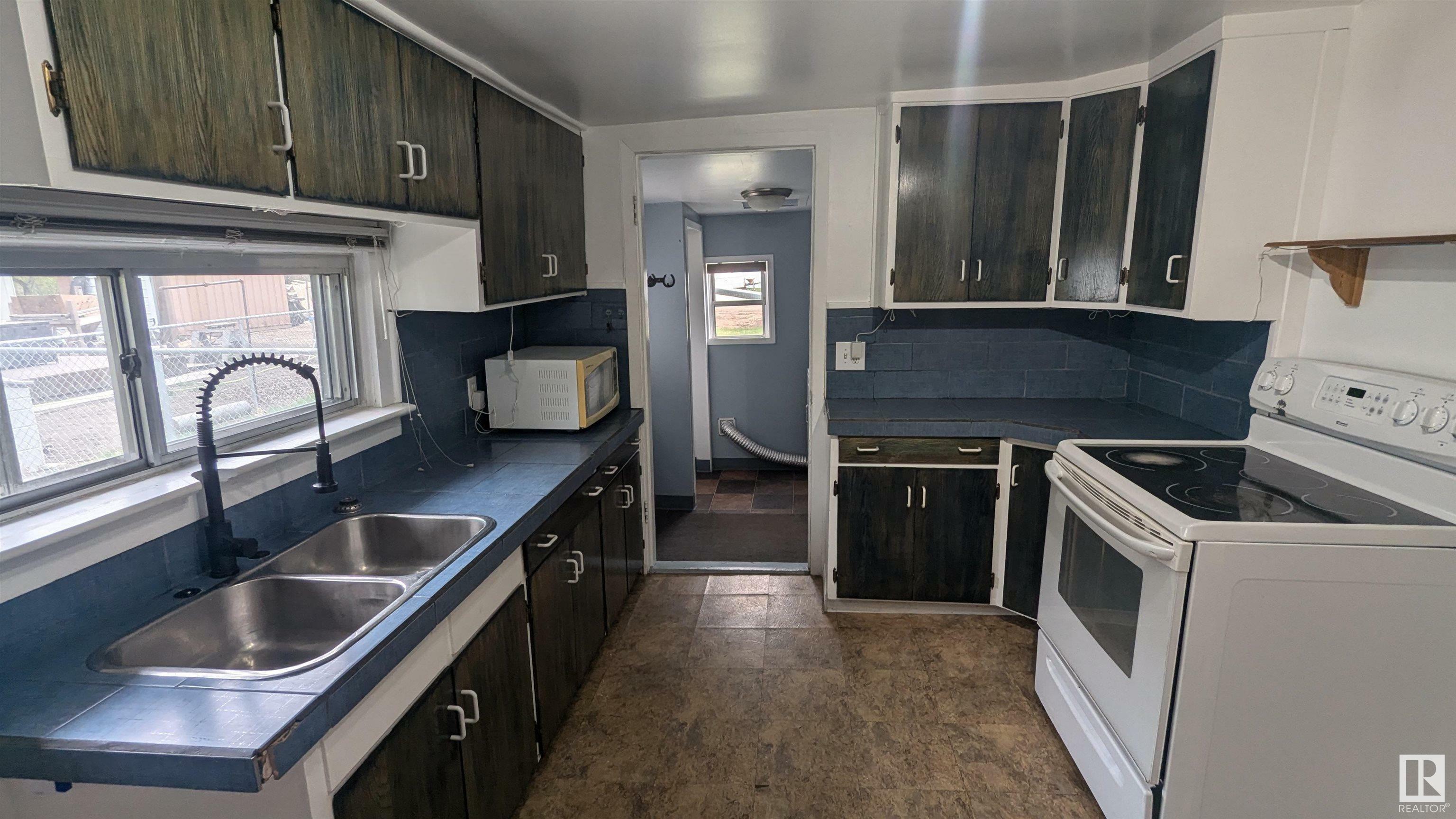 Property Photo: 4410 48A Street AB T9C 1A8