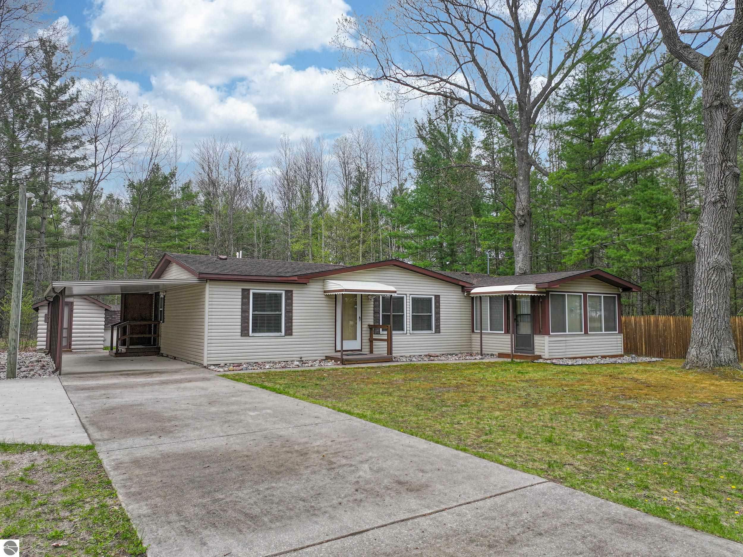 Property Photo:  2755 NE Log Lake Road  MI 49646 