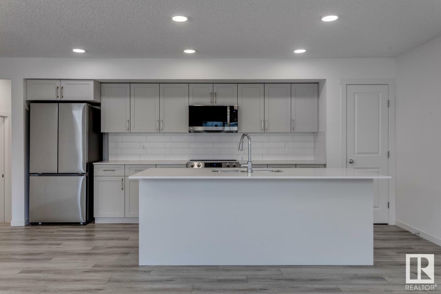 Property Photo: 905 172 Street SW 33 AB T6W 5L8