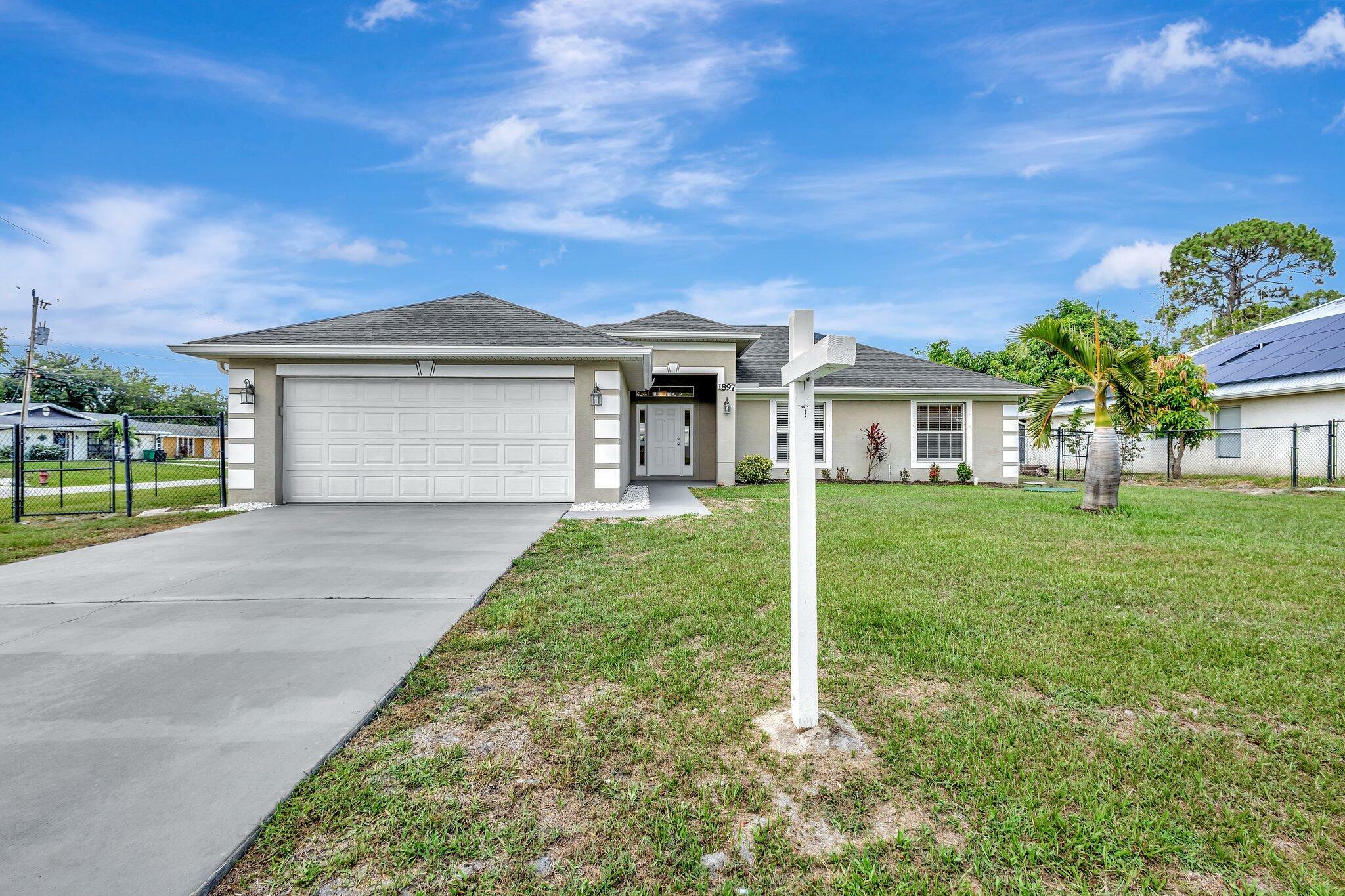 Property Photo: 1897 SW Lofgren Avenue FL 34953