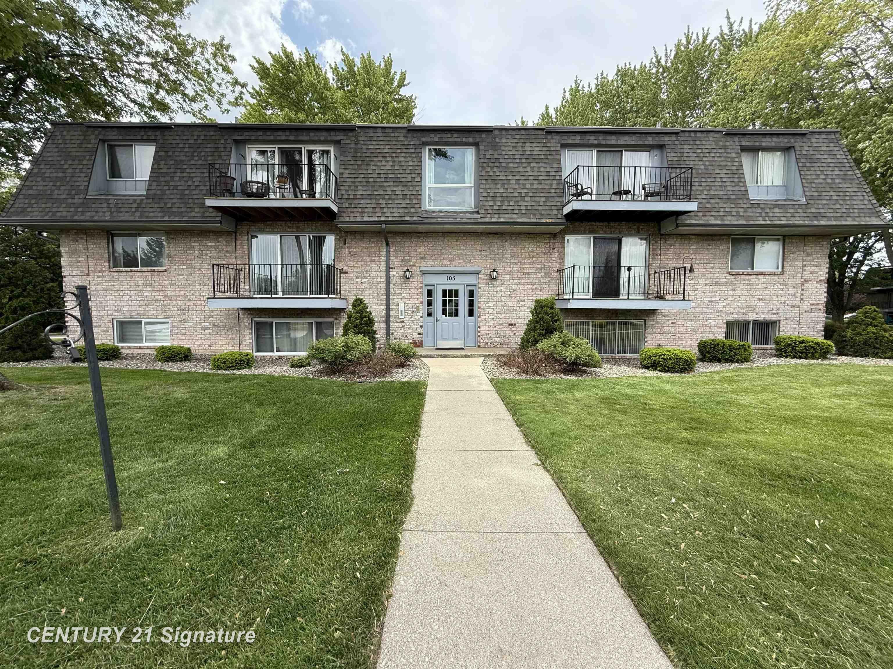 Property Photo: 105 Provincial Court #4 MI 48638