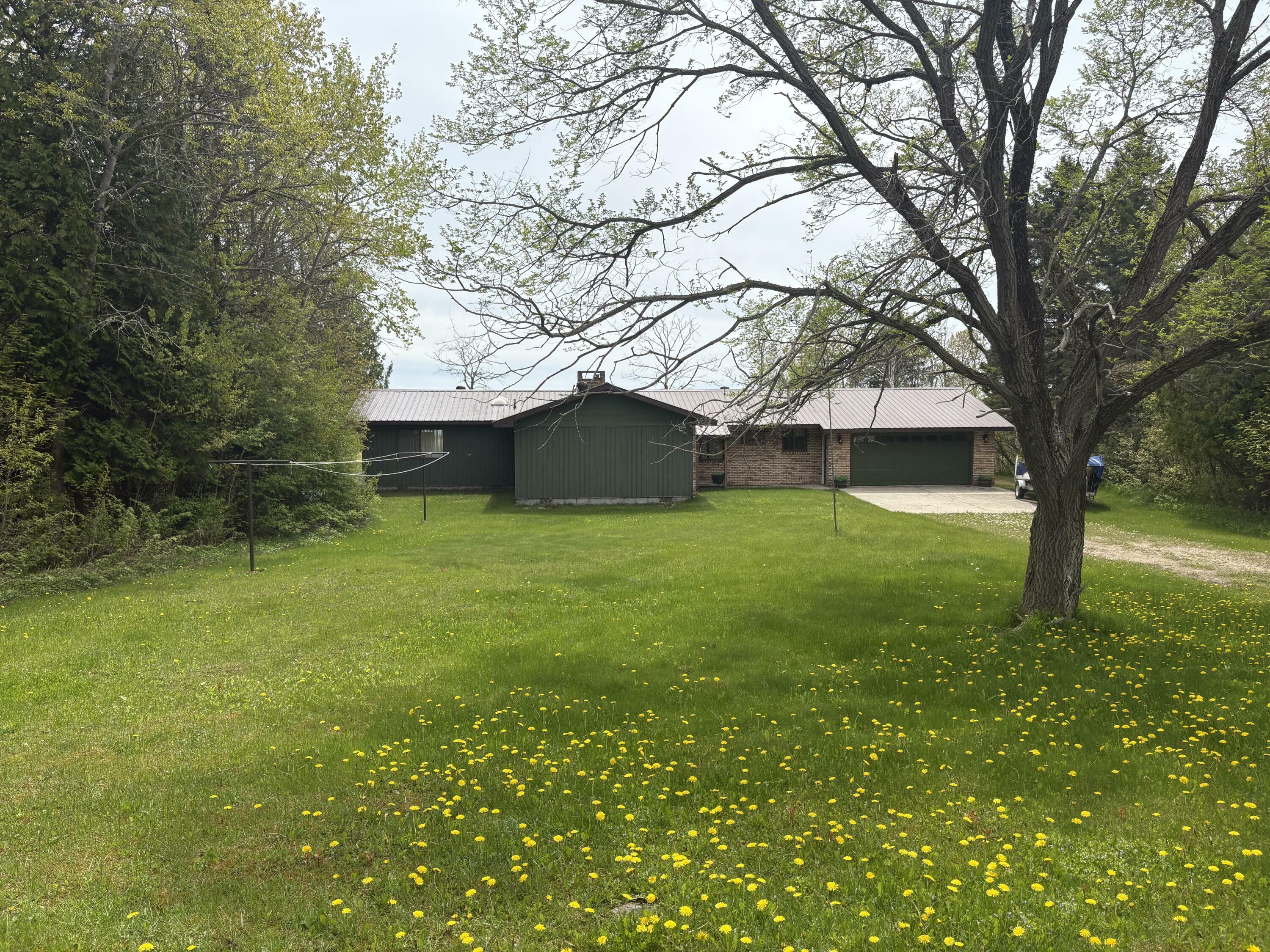 Property Photo: W11991 Middle Beach Rd MI 49762