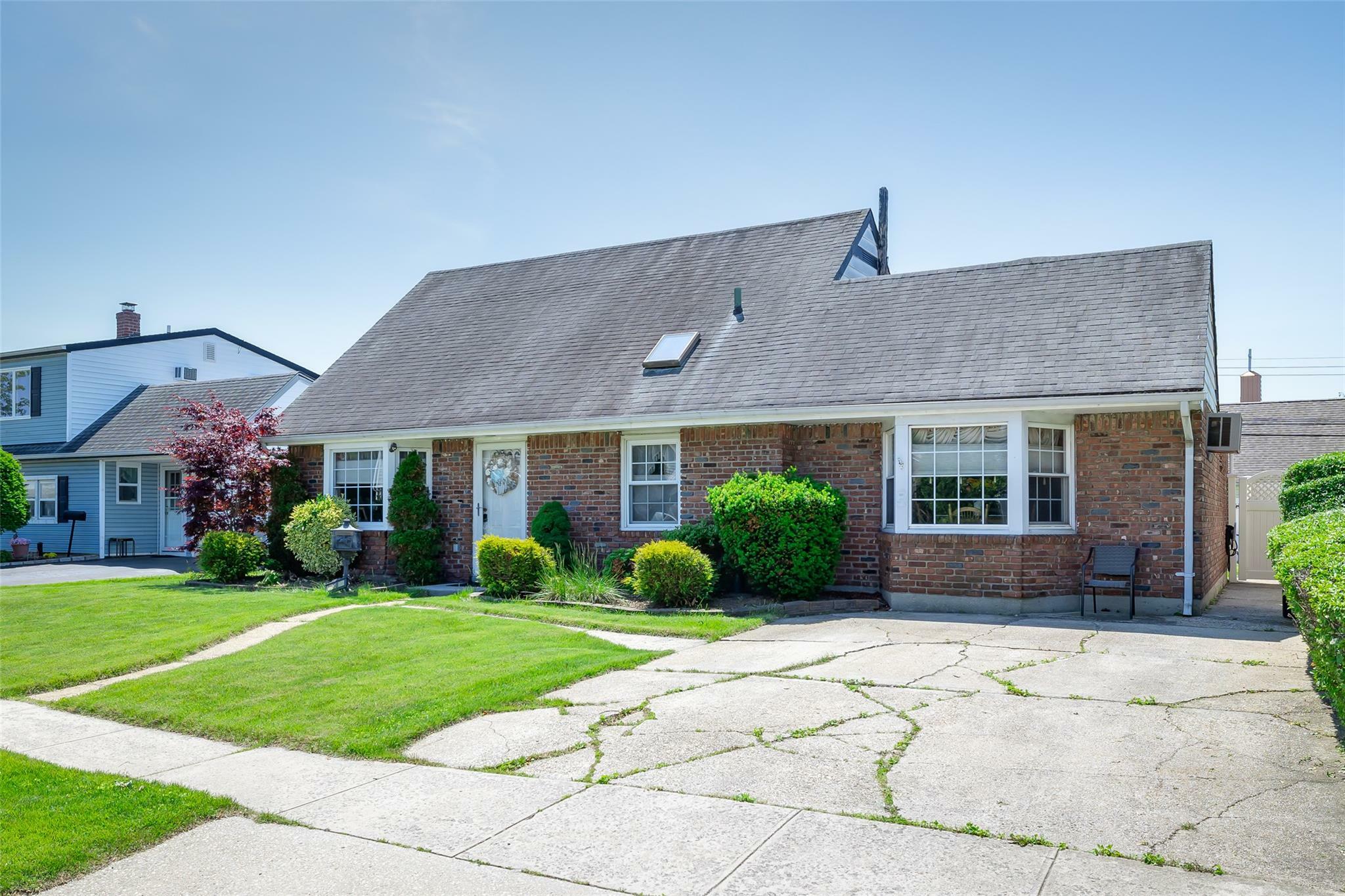 Property Photo: 98 Bluespruce Road NY 11756