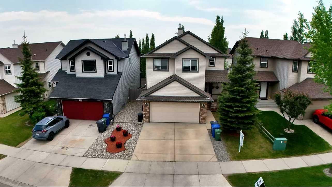 Property Photo: 43 Crystal Shores Road AB T1S 2H6