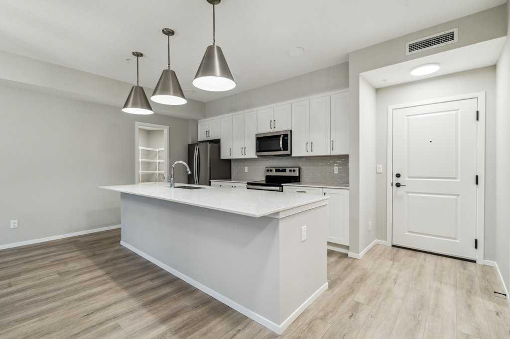 Property Photo: 140 Mahogany Street SE 306 AB T3M 4E1