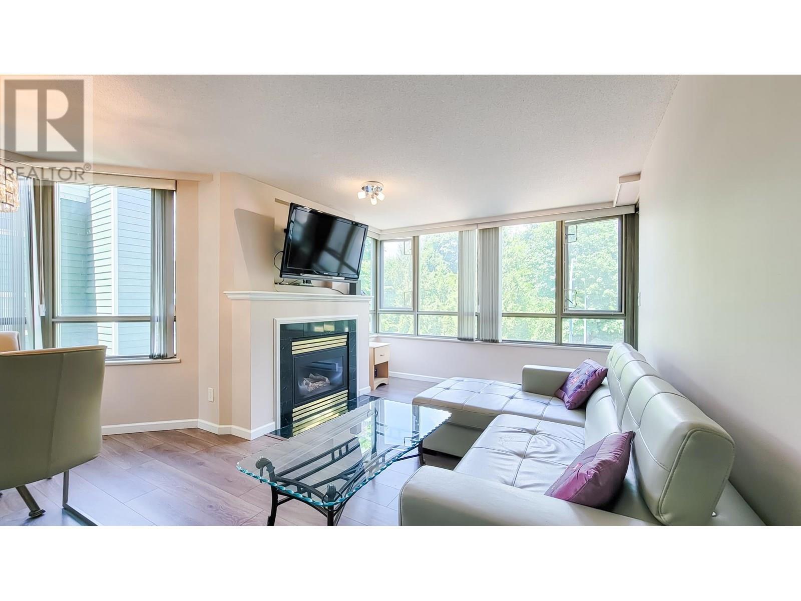 Property Photo: 3070 Guildford Way 203 BC V3B 7R8