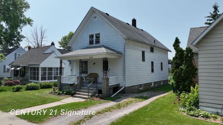 Property Photo:  408 S Alp Street  MI 48706 