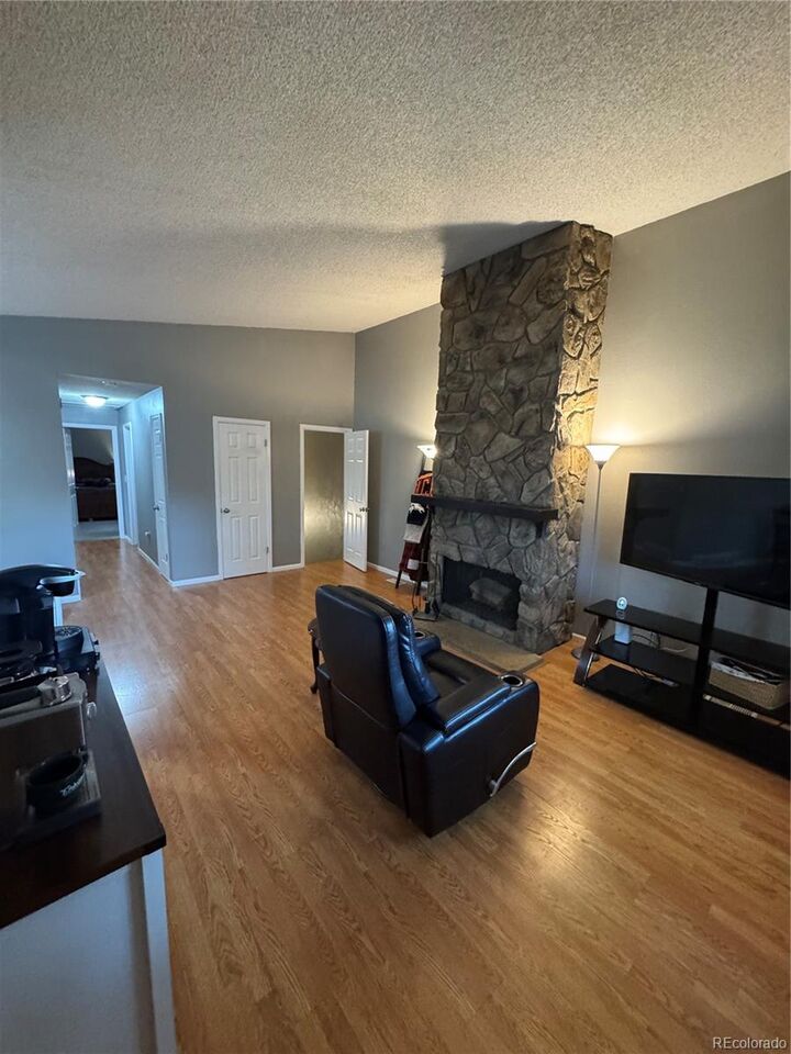 Property Photo:  7020 W Portland Avenue  CO 80128 