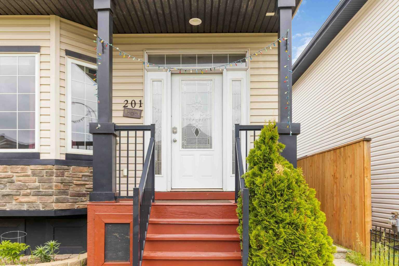 Property Photo: 201 Grouse Way AB T9K 0L9