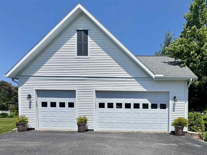 Property Photo:  7570 Bay Meadow  MI 49740