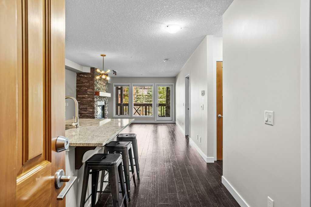 Property Photo: 106 Stewart Creek Landing 220 AB T1W 0G6