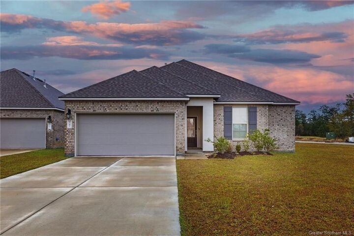 Property Photo:  1701 Sawgrass Drive  LA 70669 