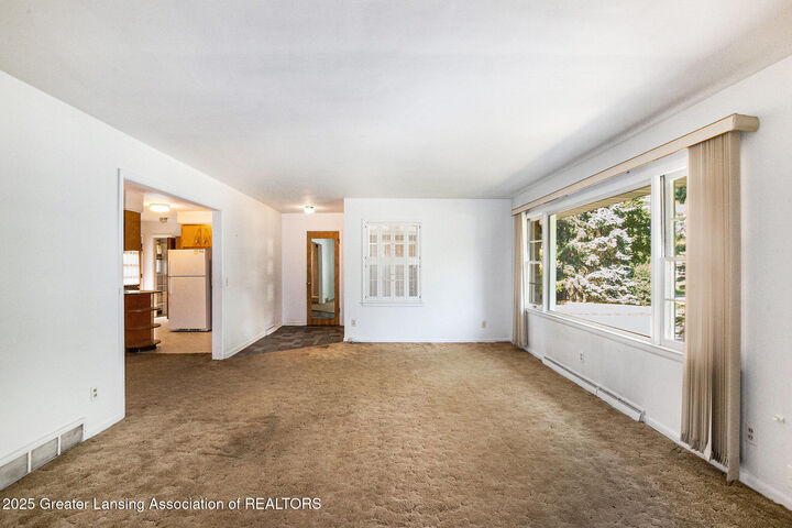 Property Photo:  1606 Forest Hills Drive  MI 48864 