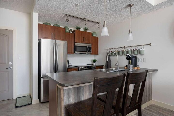 Property Photo:  204 Sparrow Hawk Drive 2317  AB T9K 0P1 