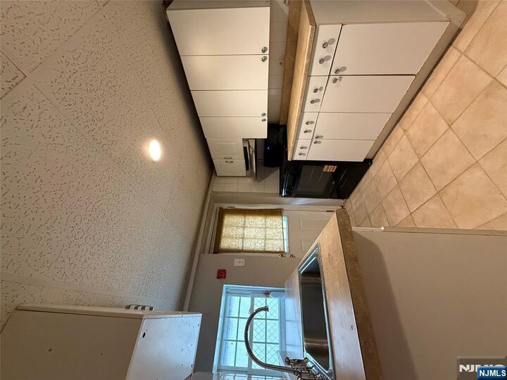 Property Photo:  1430 44th Street 1  NJ 07047 