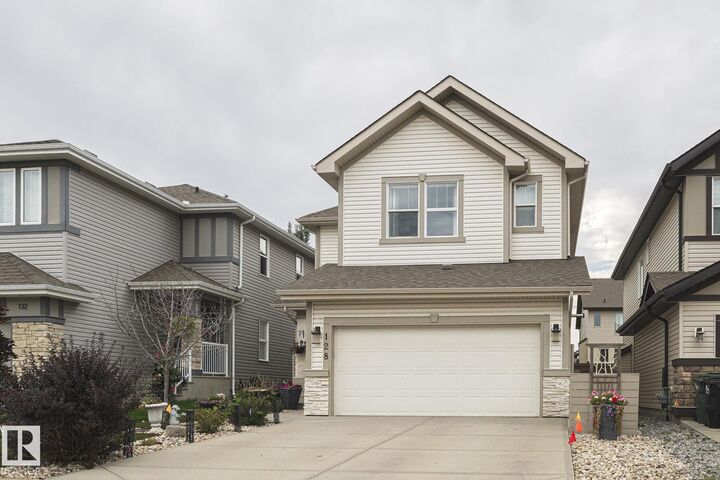 Property Photo:  128 Sandalwood Crescent  AB T8H 0S4 