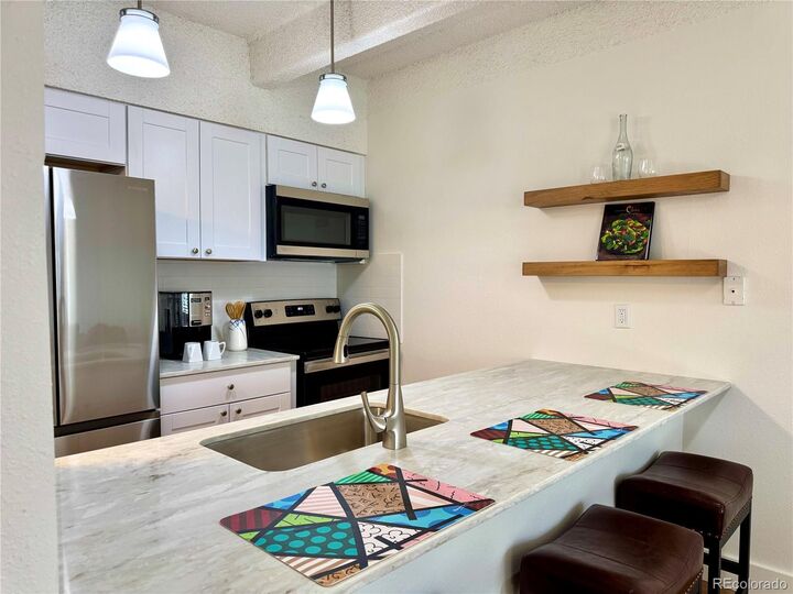 Property Photo: 7877 E Mississippi Avenue 103 CO 80247