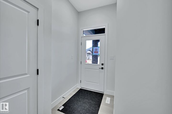 Property Photo: 104 Allard Link SW 24 AB T6W 2N2