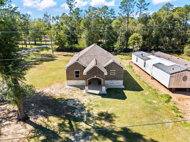 Property Photo:  138 County Road 3314  TX 77327 