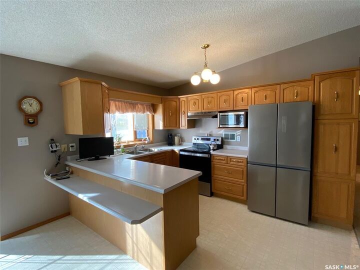 Property Photo:  205 Morrison Drive  SK S3N 4A1 