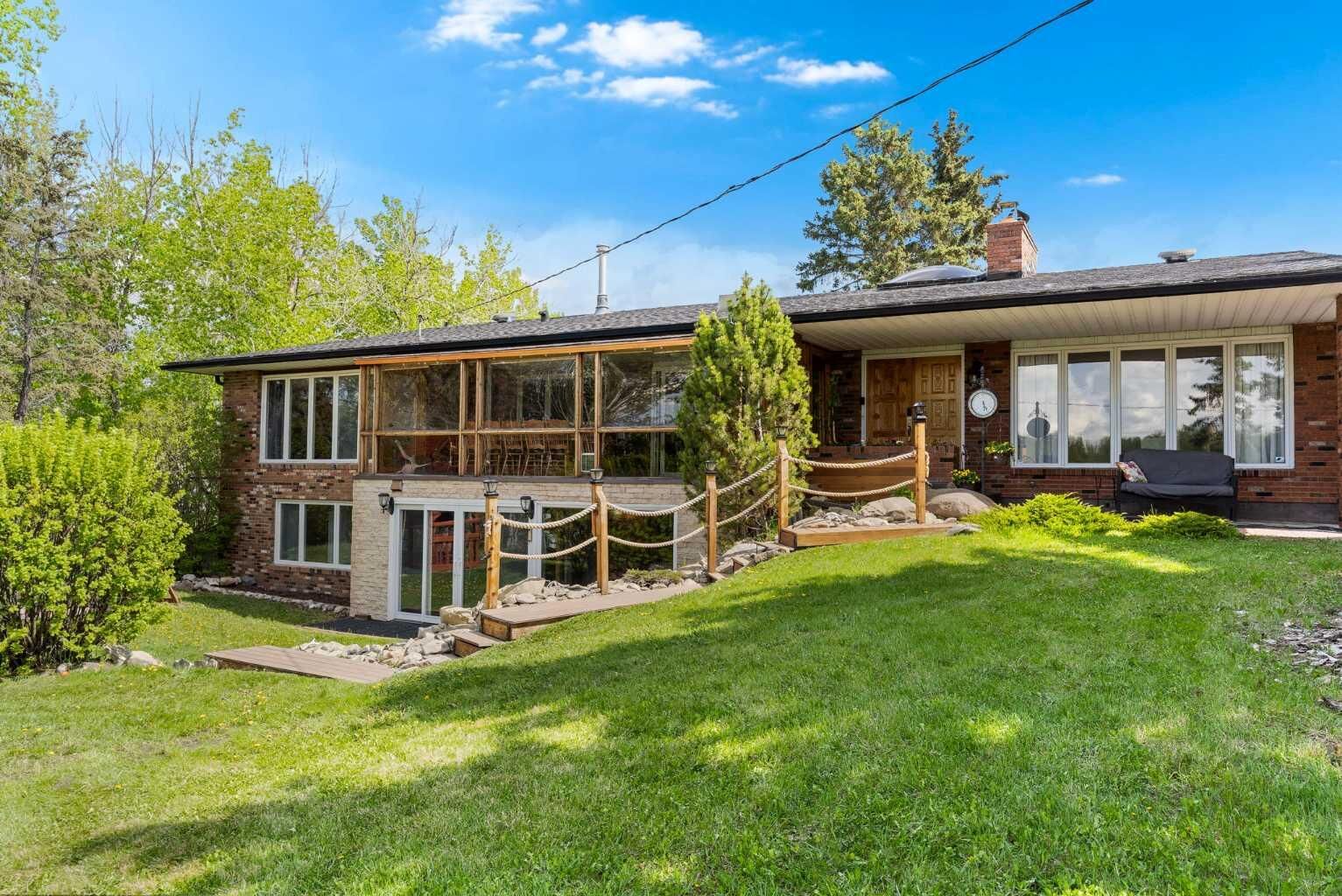 Property Photo: 24157 Meadow Drive AB T3R 1A8